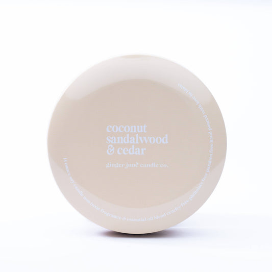 nude tin: coconut sandalwood + cedar 14 oz candle